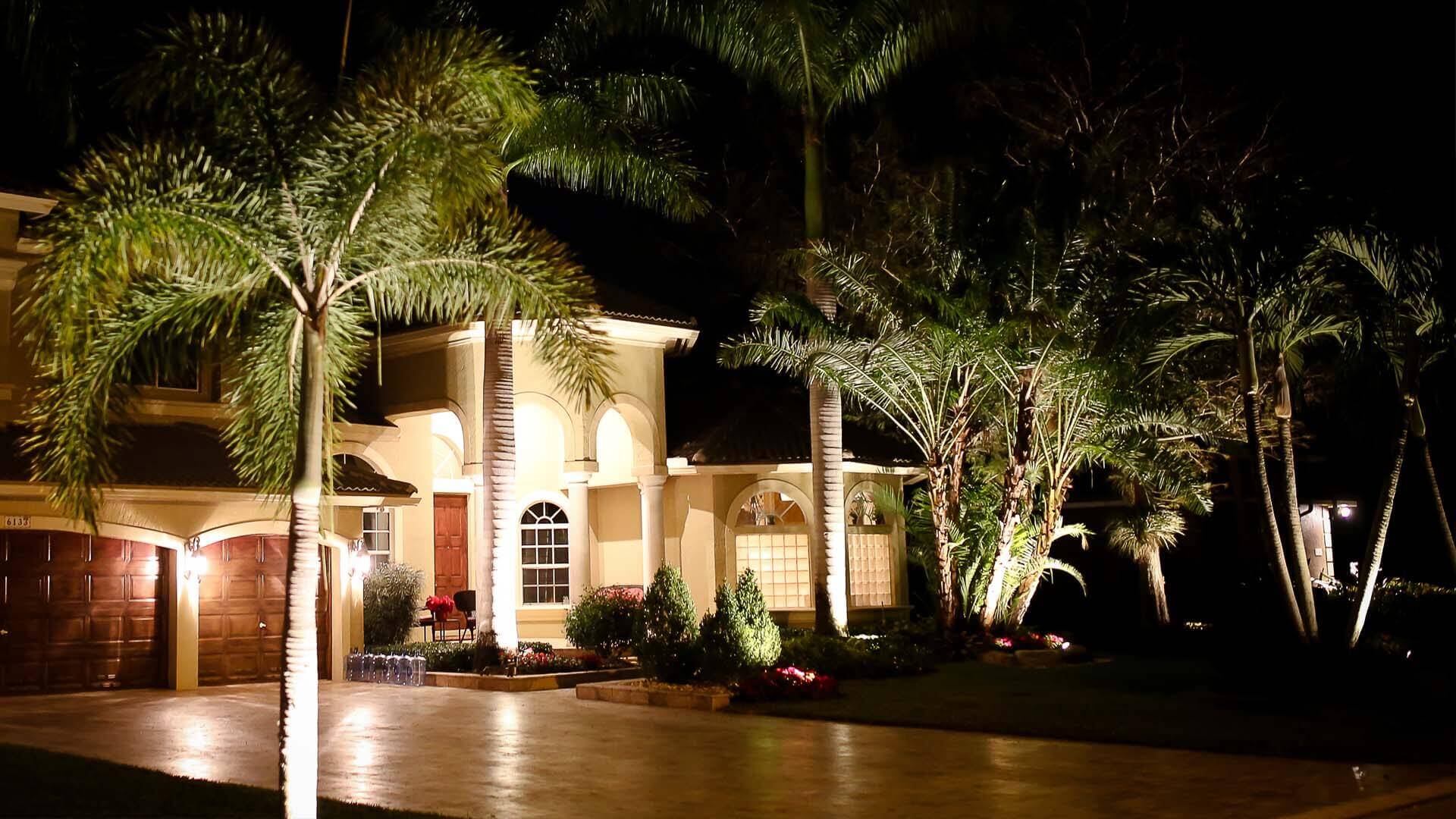 Custom landscape lighting at a beautiful estate in Boca Raton, FL