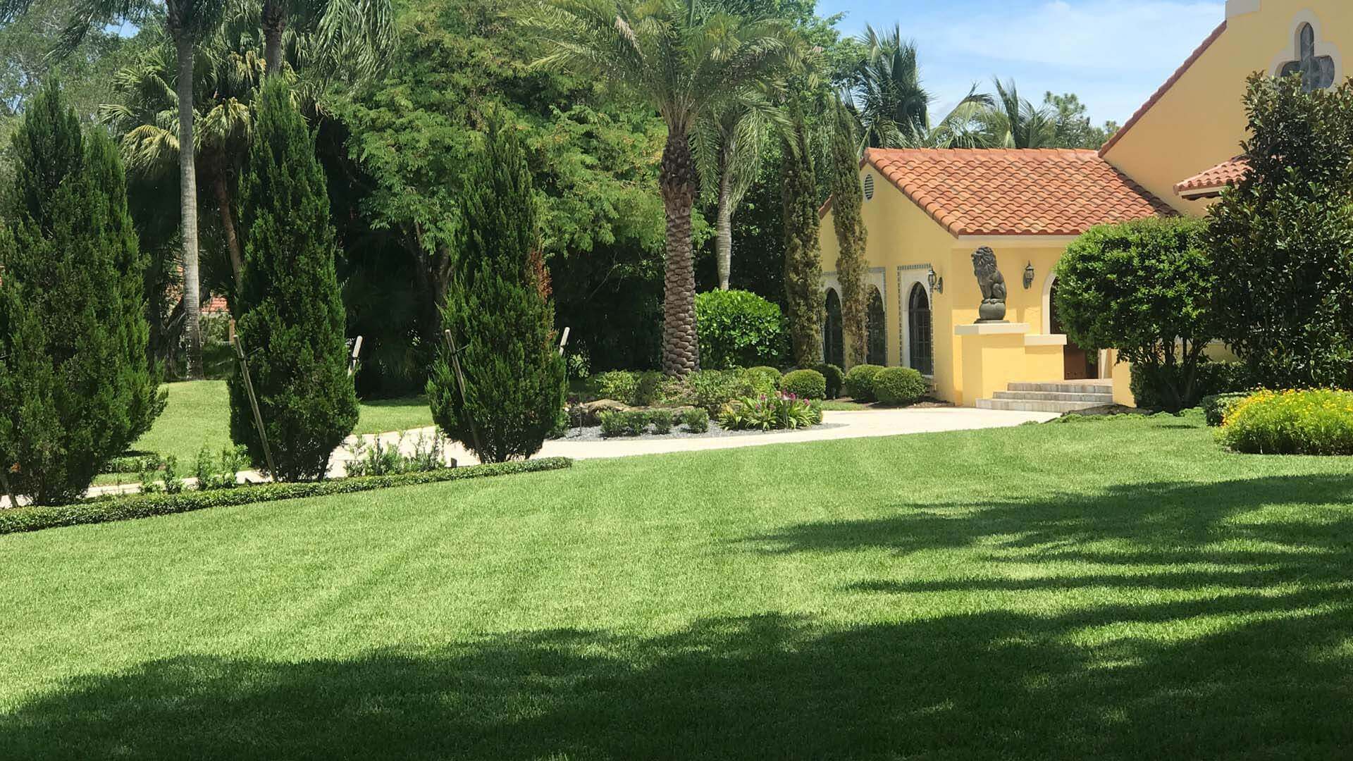 Lawn mowing and landscape maintenance at a residential estate in Fort Lauderdale, FL