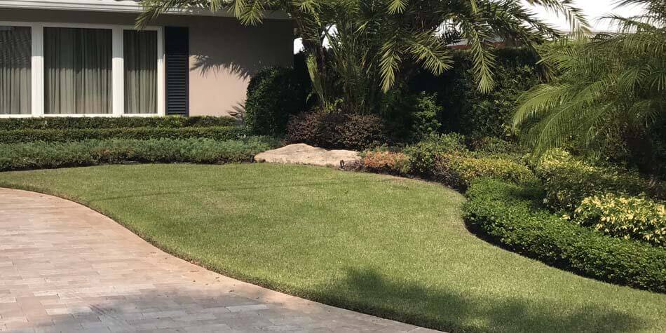 Front lawn mowing and landscape maintenance by Go2Scape.Inc in Fort Lauderdale, FL